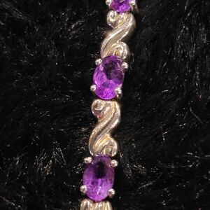 7.5" Sterling and amethyst tennis bracelet